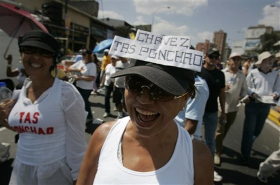An anti-government protester in Caracas, Venezuela, wears a cap that reads "Chavez you're struck out" during a march on Jan. 23.